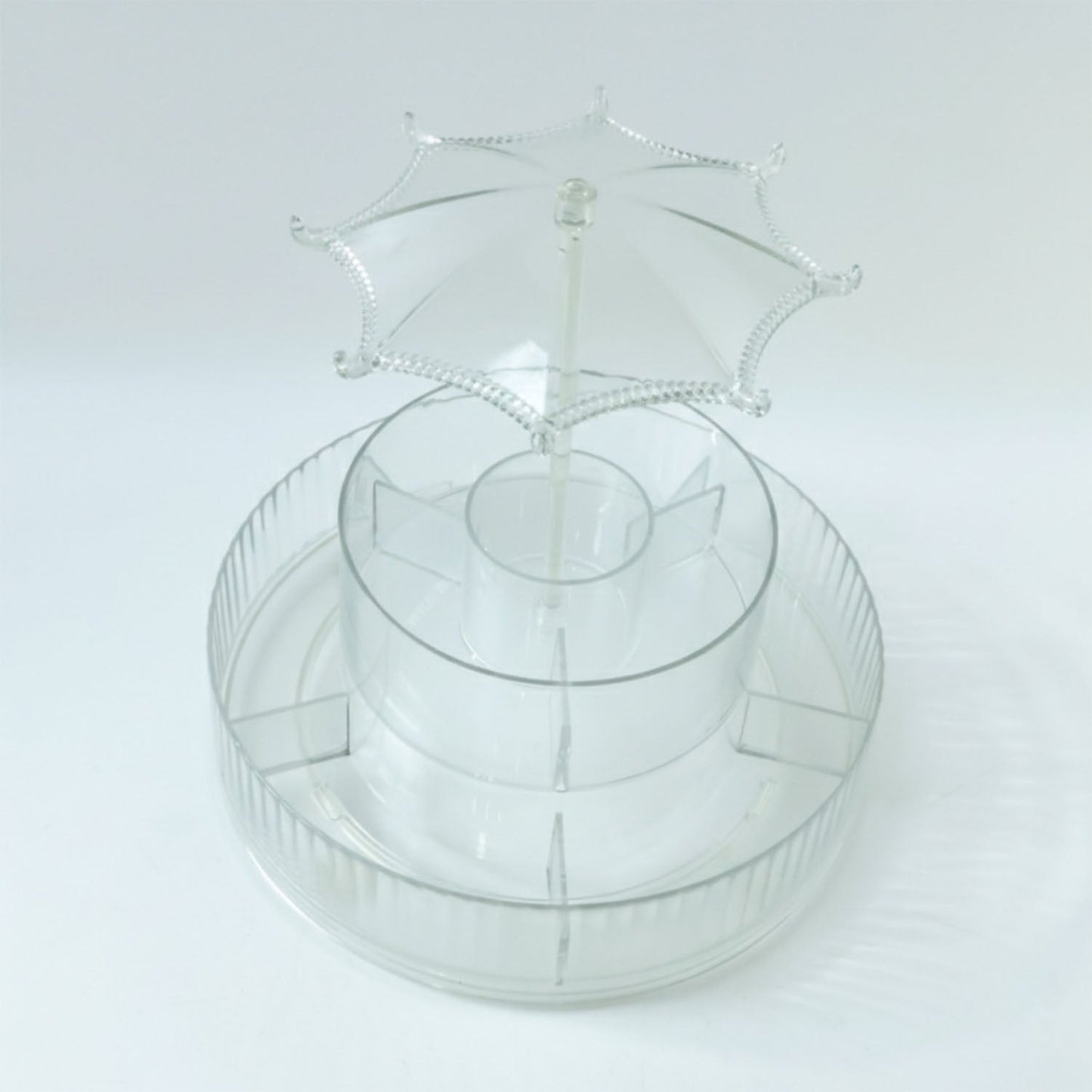 Spinning makeup and jewellery holder